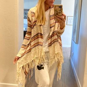 I bought two!! Love this fringe wrap for summer! Size OS